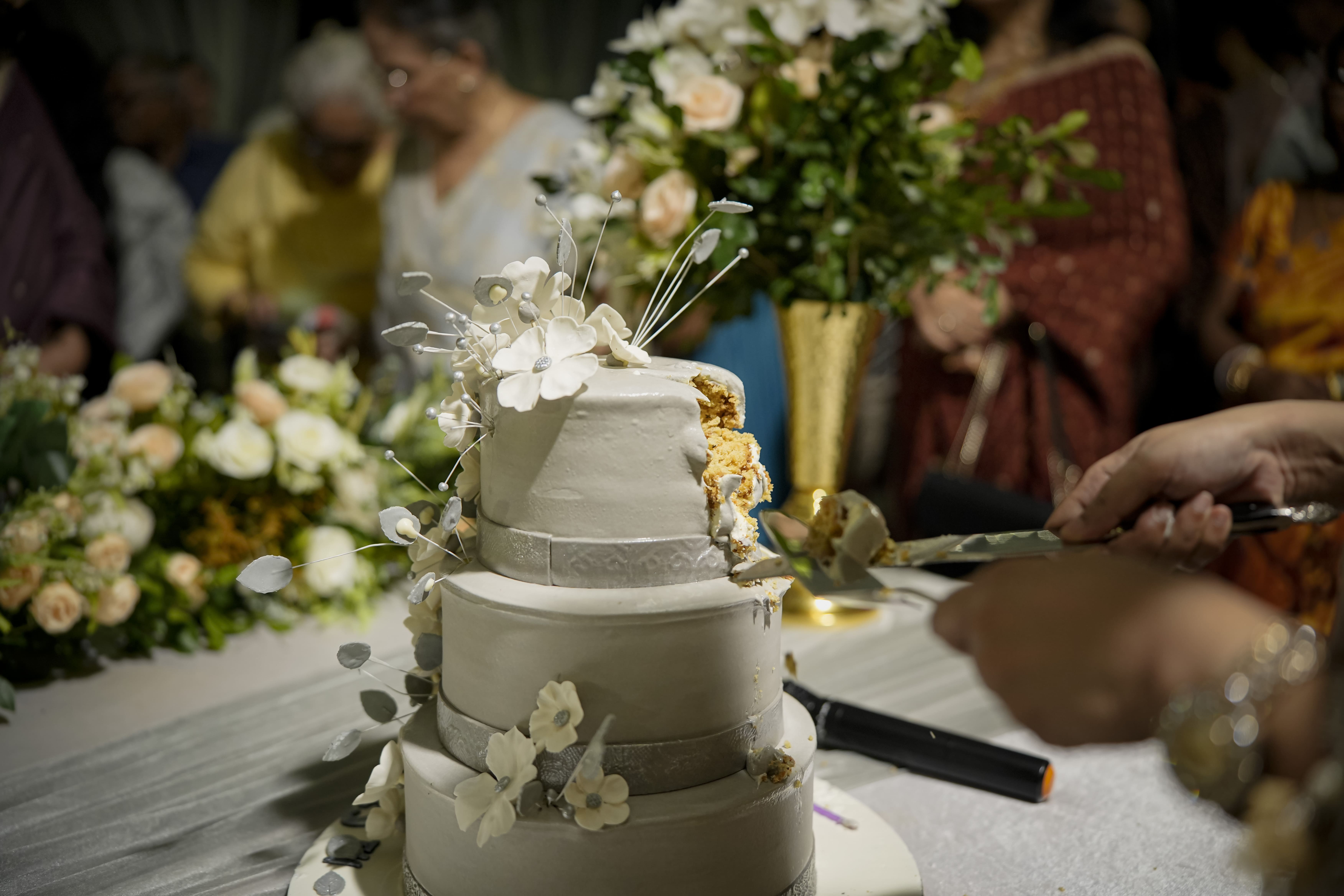 Mithoo and Parag stood at the center, beaming with joy, ready to cut the beautifully crafted anniversary cake. 